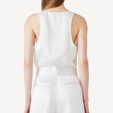 Back view of ivory S/L Silk/Viscose Tank Top on model wearing white pants, against a white background.