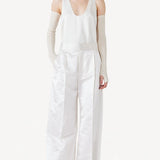 Front view of ivory S/L Silk/Viscose Tank Top on model wearing white pants, against a white background.