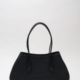 Black handbag on a white background