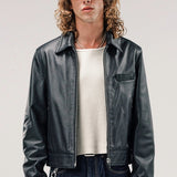 Front view of black ant de padovane jacket on model wearing white shirt and jeans, against a white background.