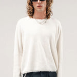 Front view of blanc friends pullover sweater on model wearing grey pants, against a white background.