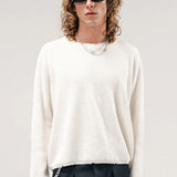 Front view of blanc friends pullover sweater on model wearing grey pants, against a white background.