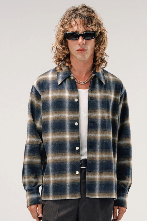 Front view of olive check logan ombre ls shirt on model wearing white shirt and grey pants, against a white background.