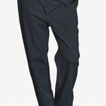 Front closeup view of titan midnight assk pants on model wearing navy top and boots, against a white background.