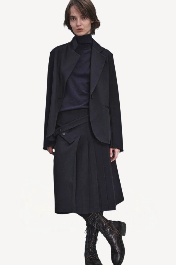 Front view of titan midnight cate jacket on model wearing black kilt and boots, against a white background.
