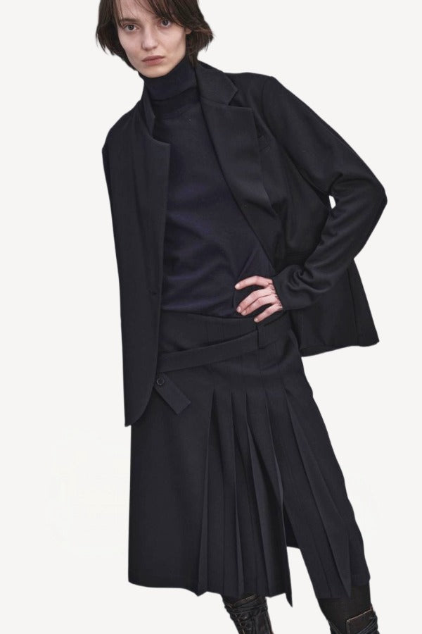 Front closeup view of titan midnight cate jacket on model wearing black kilt and boots, against a white background.