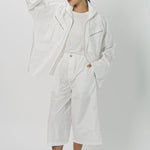 Alternate front view of snow buck ls shirt on model wearing white shirt and pants, against a white background.