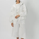 Alternate front view of snow buck ls shirt on model wearing white shirt and pants, against a white background.