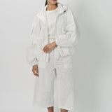 Alternate front view of snow buck ls shirt on model wearing white shirt and pants, against a white background.