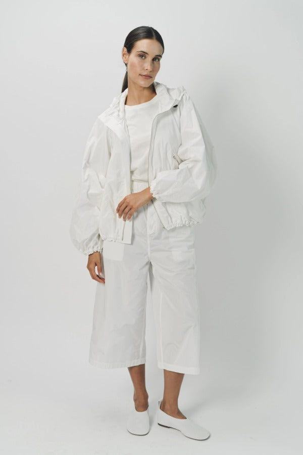 Alternate front view of snow buck ls shirt on model wearing white shirt and pants, against a white background.