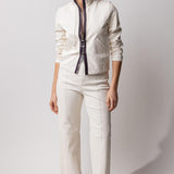 Front view of white my way jacket on model wearing white leather pants and black snadals, against white background