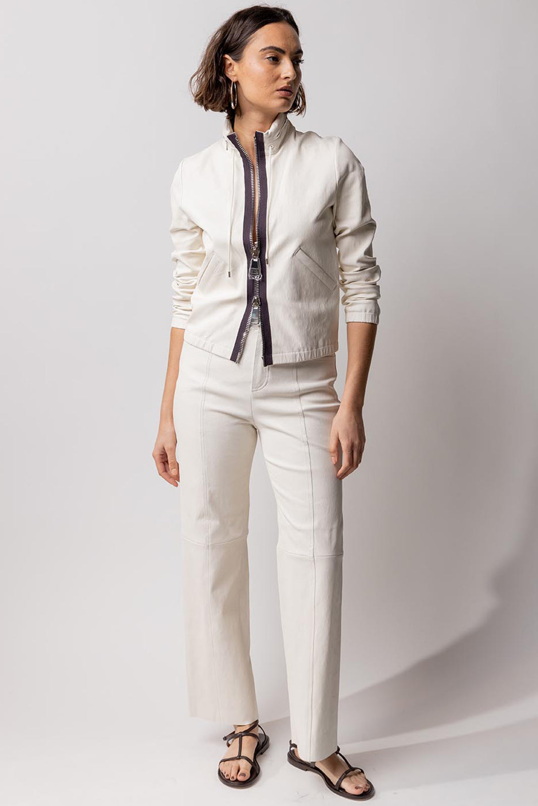 Front view of white my way jacket on model wearing white leather pants and black snadals, against white background