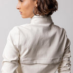 Back closeup view of white my way jacket on model against a white background.