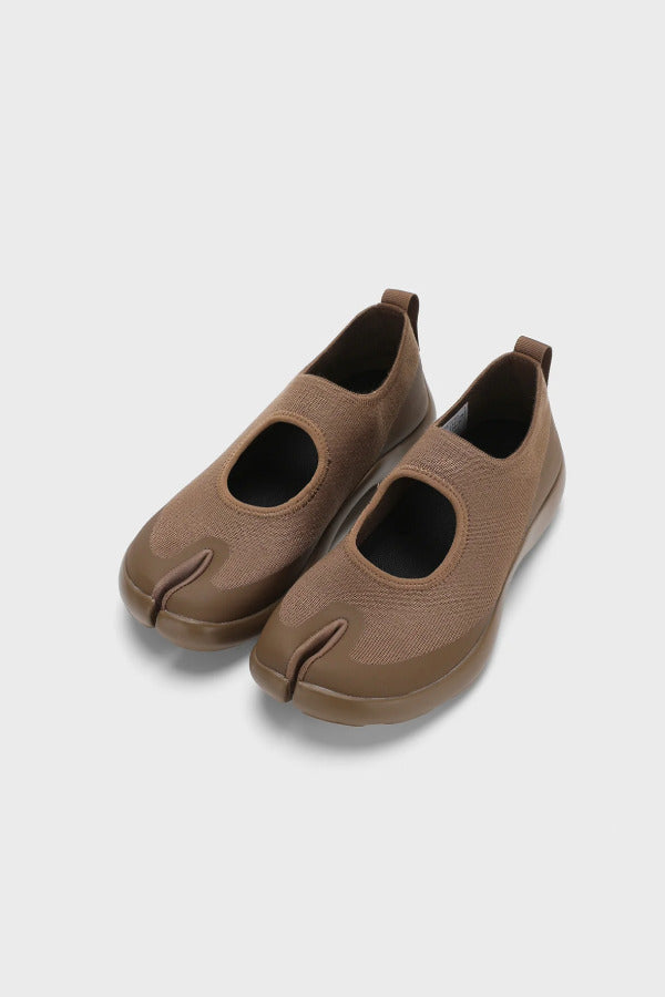 Front view of chocolate tabi sandals on white background, with no model shown.