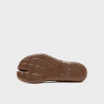 Bottom view of chocolate tabi sandal on white background, with no model shown.
