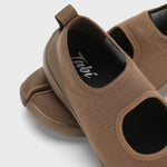 Back closeup view of chocolate tabi sandal on white background, with no model shown.