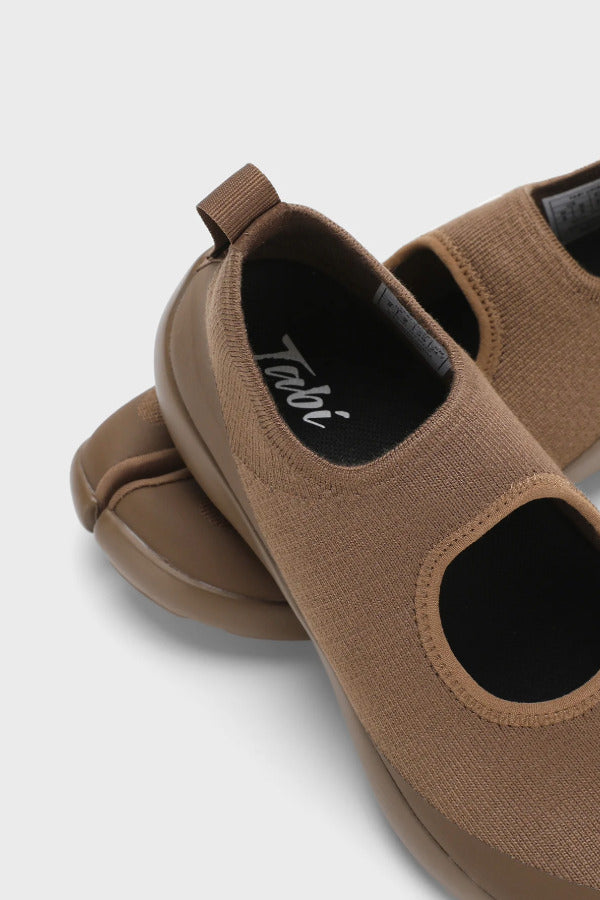Back closeup view of chocolate tabi sandal on white background, with no model shown.