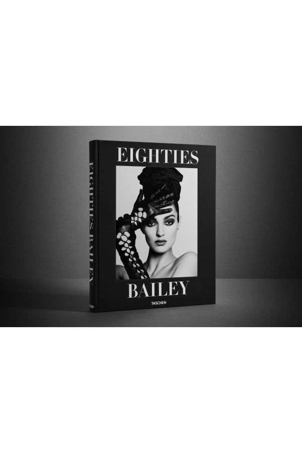 Front view of taschen david baileys eighties book on charcoal background.