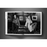 Open view of taschen david bailey eighties book on charcoal background.
