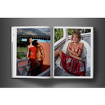 Open view of taschen david bailey eighties book on charcoal background.