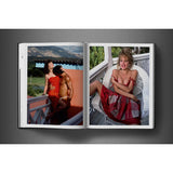Open view of taschen david bailey eighties book on charcoal background.