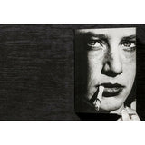 Front view of taschen helmut newton's Legacy book on black background.