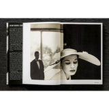 Open view of taschen helmut newton's book Legacy on black background.