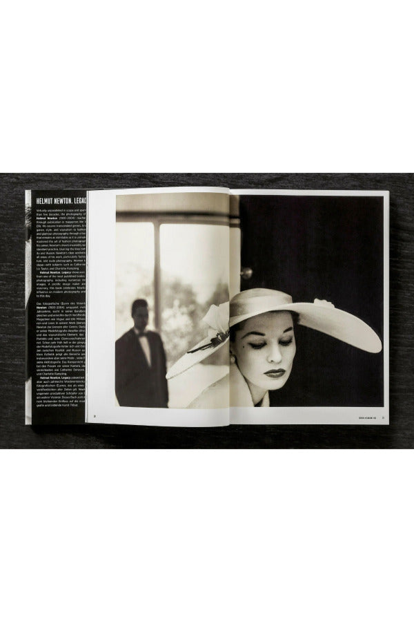 Open view of taschen helmut newton's book Legacy on black background.