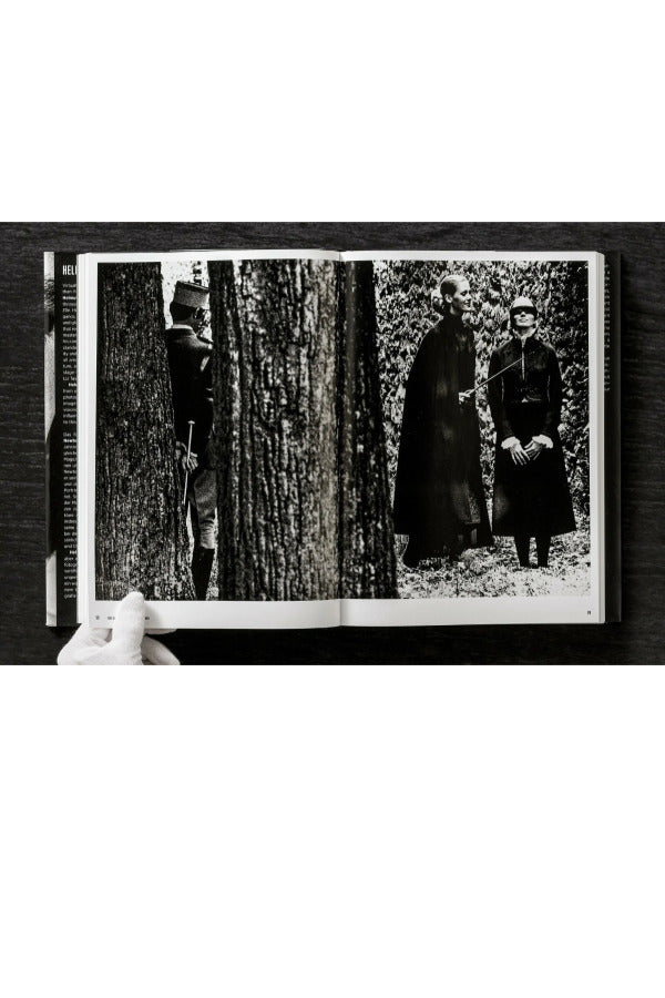 Open view of taschen helmut newton's Legacy book on black background.