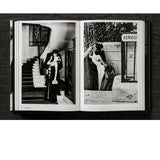 Open view of taschen helmut newton's Legacy book on black background.