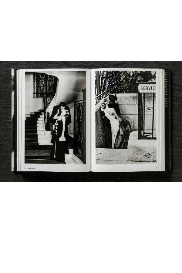 Open view of taschen helmut newton's Legacy book on black background.