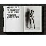 Open view of taschen helmut newton's Legacy book on black background.