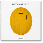 Front view of taschen issey miyake book on white background.