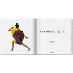 Open book view of taschen issey miyaki on white background.