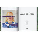 Open book view of taschen julian schnable book on white background.