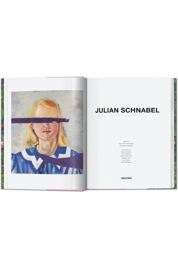 Open book view of taschen julian schnable book on white background.