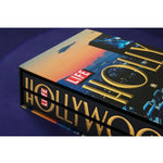 Side view of taschen life hollywood book on blue background.