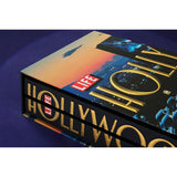 Side view of taschen life hollywood book on blue background.