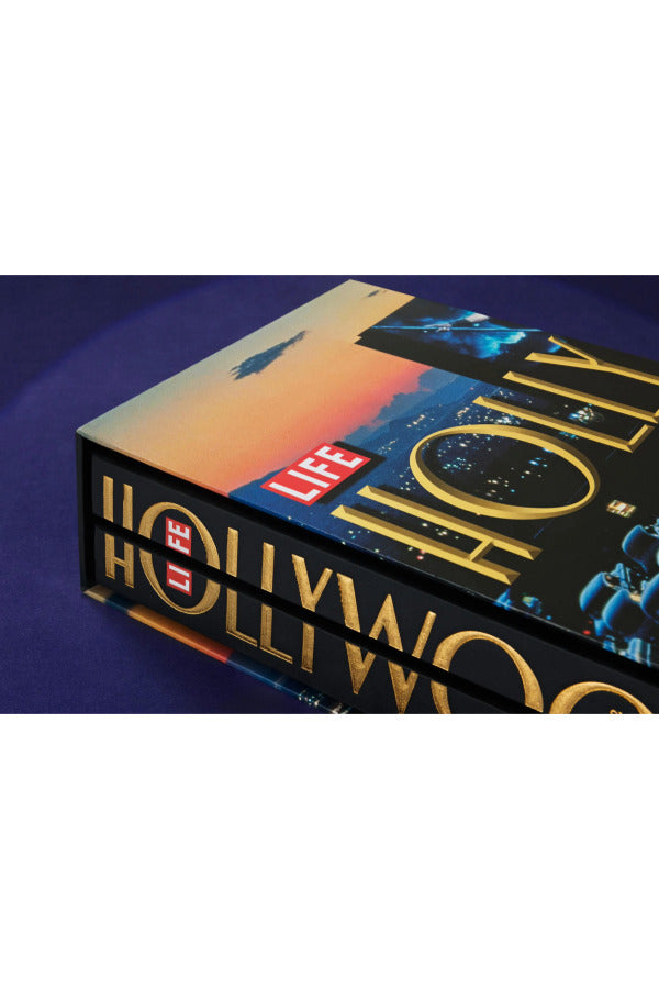 Side view of taschen life hollywood book on blue background.