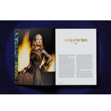 Open view of taschen life hollywood book on blue background.