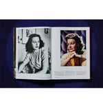 Open view of taschen hollywood book on blue background.