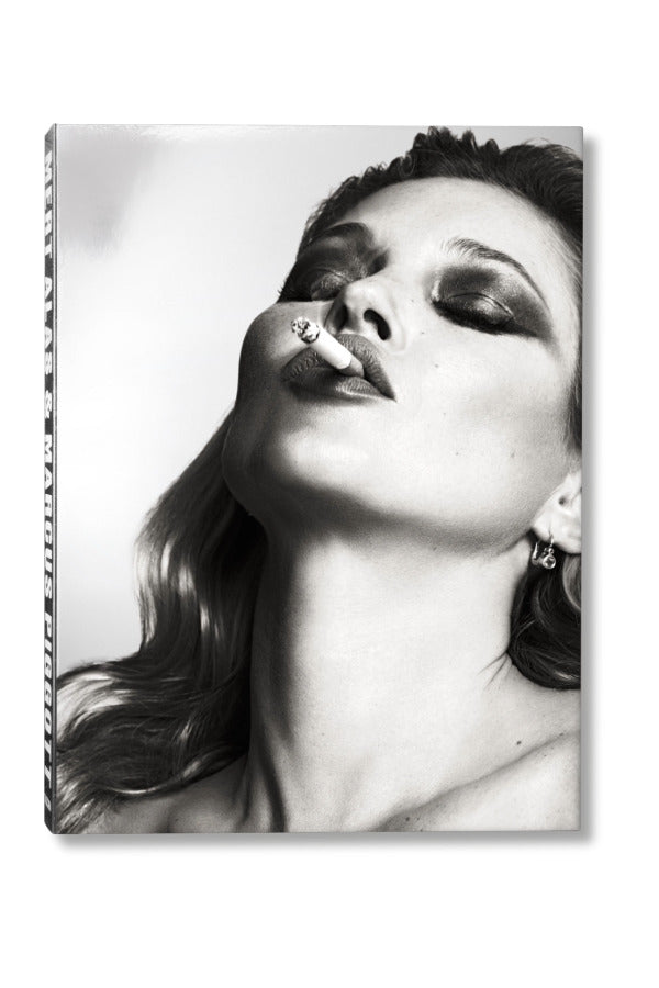 Front view of taschen mert atlas and marcus pigott book on white background.