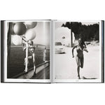 Open view of taschen mert tlas and marcus pigott book on white background.