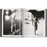 Open view of taschen mert tlas and marcus pigott book on white background.
