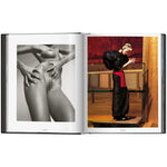 Open view of taschen mert atlas and marcus pigott book on white background.