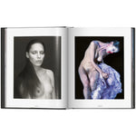 Open view of taschen mert atlas and marcus pigott book on white background.