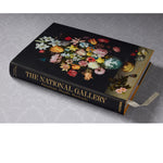 Front slanted view of taschen national gallery paintings, people book on light colored tablecloth