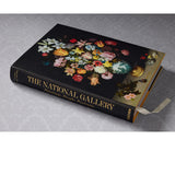 Front slanted view of taschen national gallery paintings, people book on light colored tablecloth