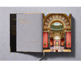 Open view of taschen national gallery paintings, people book on light colored tablecloth.