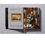Open view of taschen national gallery paintings, people book on light colored tablecloth.